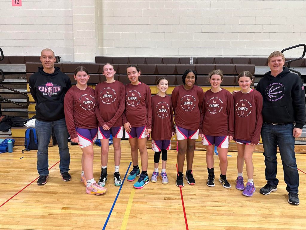 picture of 7th grade girls basketball team wearing championship t shirts